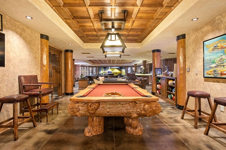 tony stewart house basement with bar and billiards table