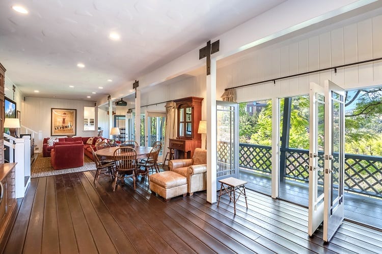 living area with large doors opening to the balcony