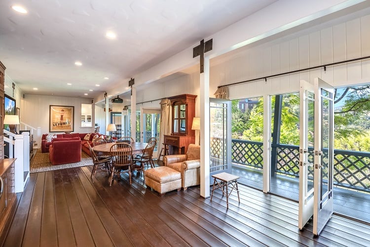 living area with large doors opening to the balcony 