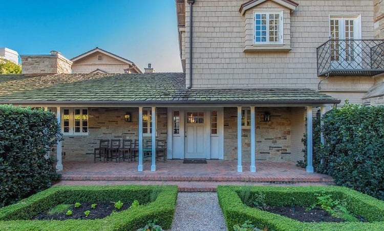 Exterior of a smaller three-bedroom house Jeff Bezos bought next door to his Beverly Hills mansion.