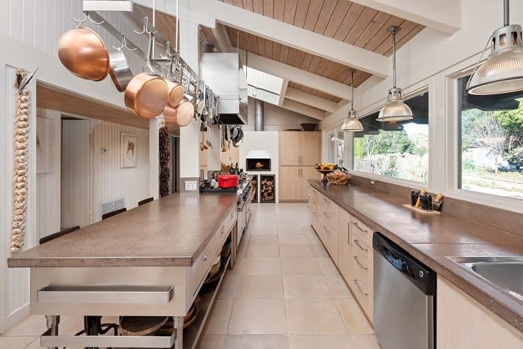 designer kitchen with exposed racks for pots and pans 