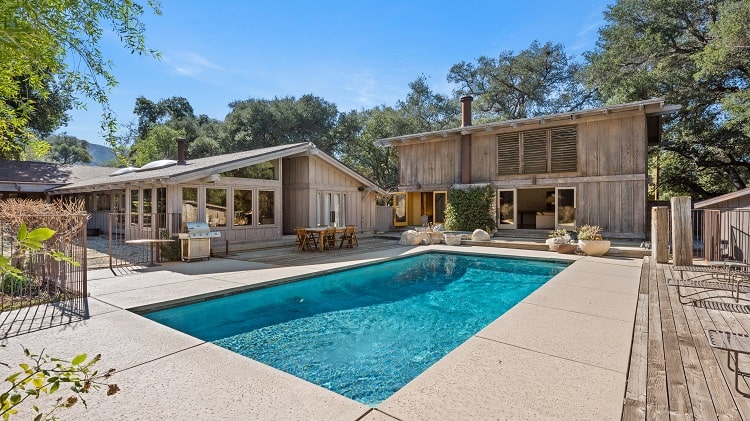 Midcentury modern house with wood barn and pool