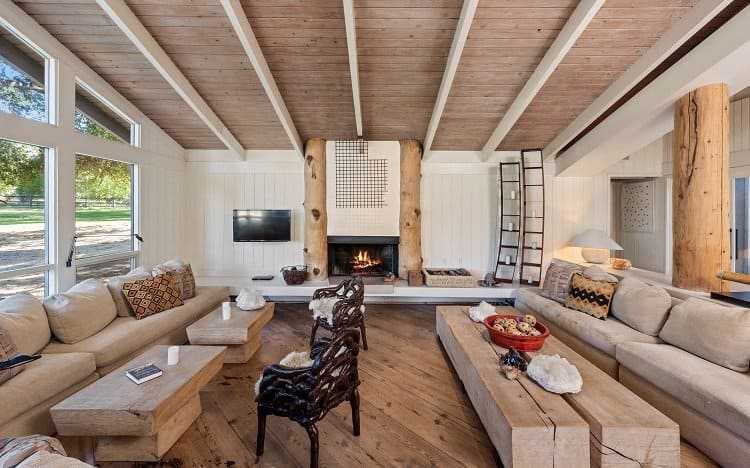 living room with a fireplace in a midcentury house designed by architect A. Quincy Jones