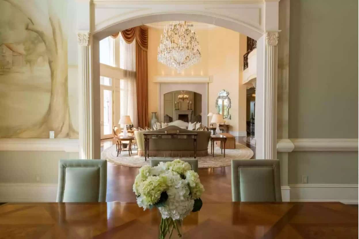 living room with chandelier inside Steve Harvey house