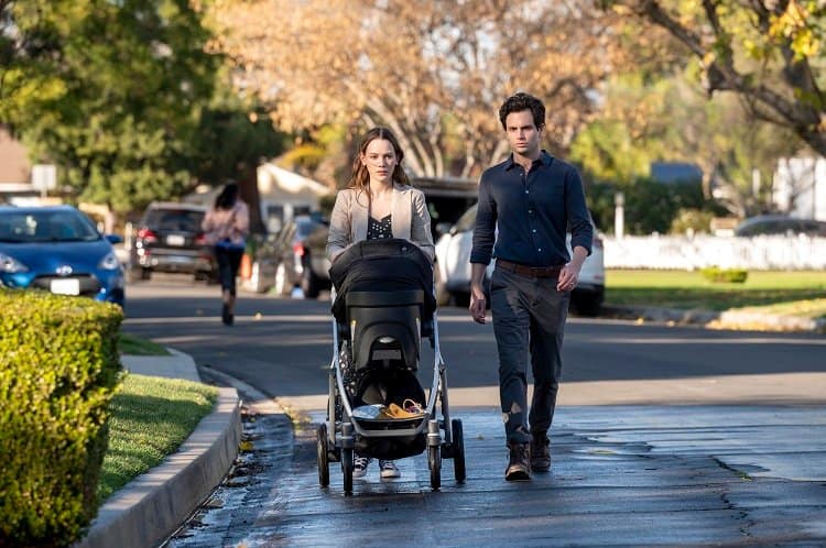 Victoria Pedretti as Love Quinn and Penn Badgley as Joe Goldberg strolling in Madre Linda on Season 3 of You.