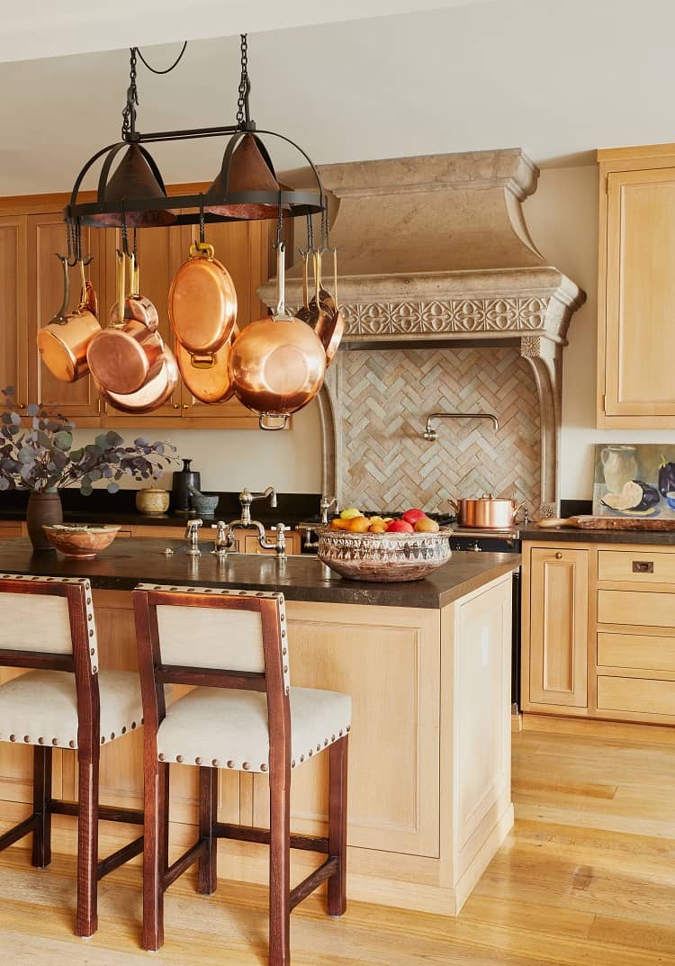 kitchen with island and hanging pots 