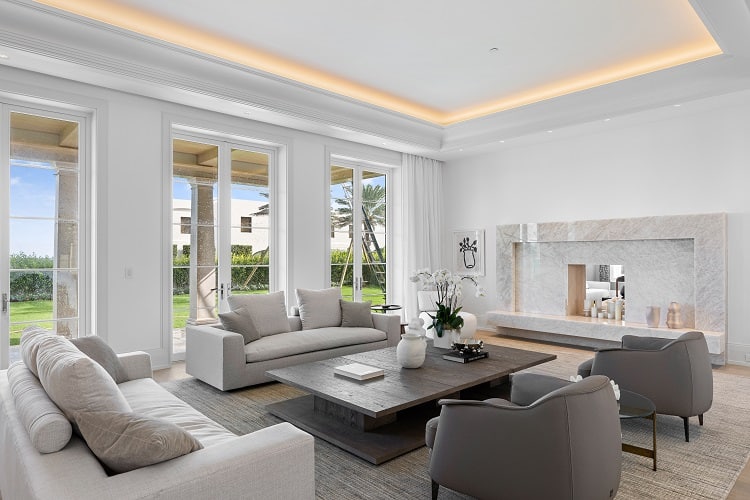 living room with fireplace in a luxury mansion in Palm Beach