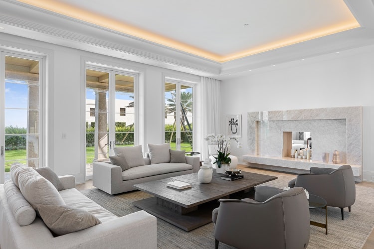 living room with fireplace in a luxury mansion in Palm Beach 