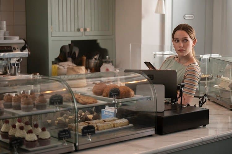 Victoria Pedretti as Love Quinn inside the bakery, A Fresh Tart. 