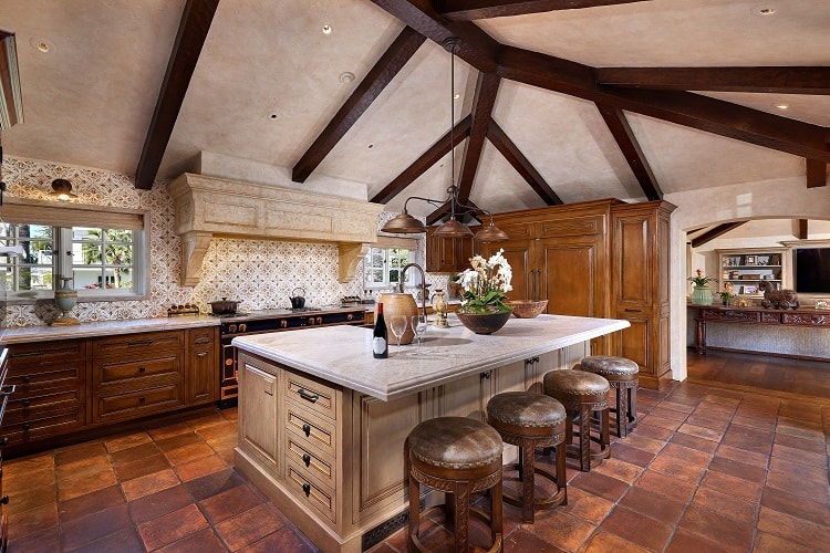 luxury kitchen with wooden beam ceilings inside the mansion known as Coronado Castle