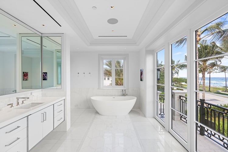 luxury white bathroom with ocean views