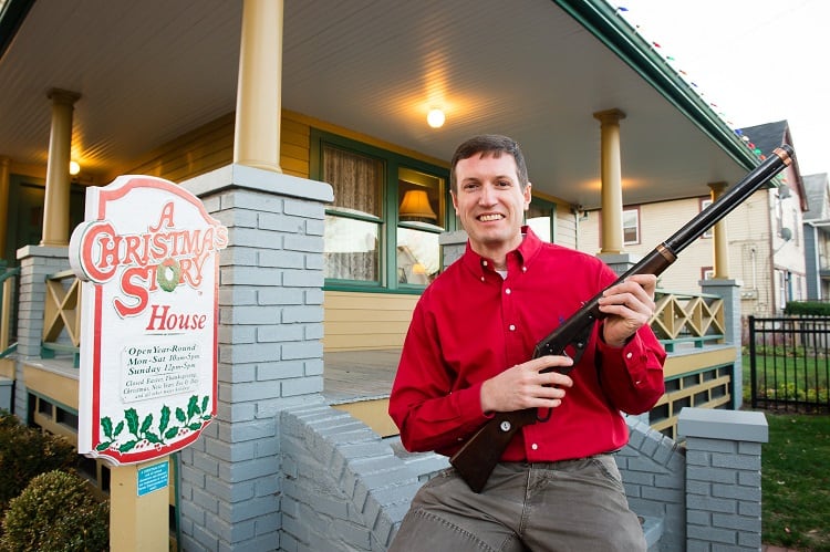 Museum owner Brian Jones holds the Red Rider BB Gun used in the movie at A Christmas Story House and Museum on Monday, Nov. 16, 2015 in Cleveland