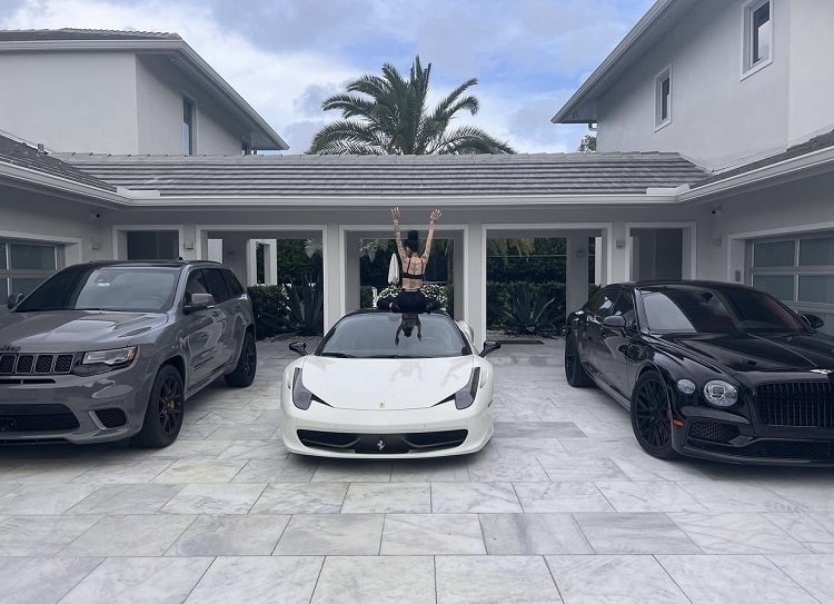 A photo of Bhad Bhabie and her impressive luxury car collection. 