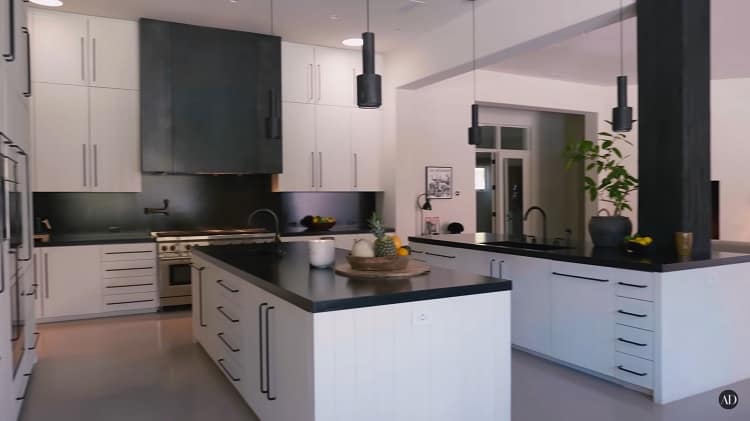 Inside the drummer's kitchen, which has been completely remodeled and features floor-to-ceiling cupboards that also mask the appliances. 