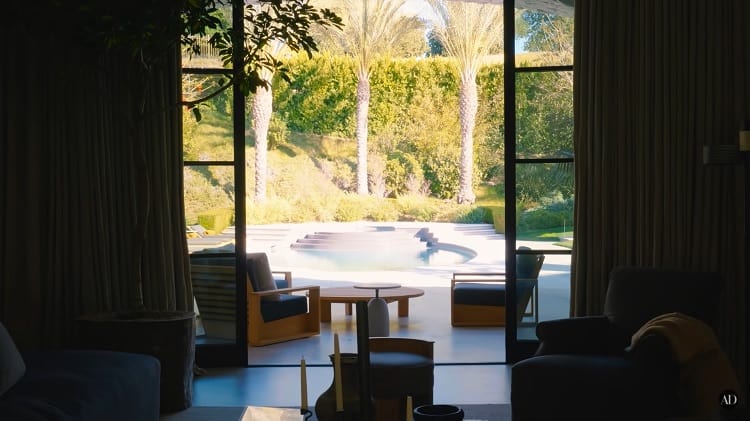Travis Barker's house has massive windows that open to the beautifully landscaped outdoor areas.
