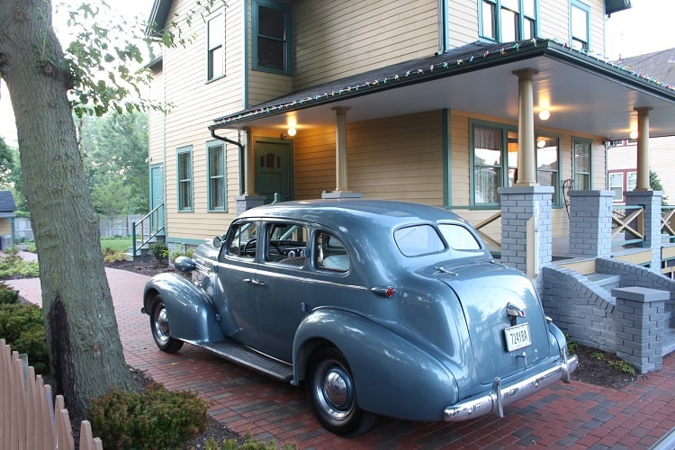 The Oldsmobile family car parked next to the 'A Christmas Story' house.