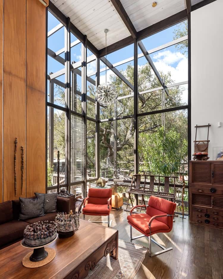 two-story tall living room with walls of glass