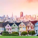 The colorful Painted Ladies houses in San Francisco, with the city in the backdrop