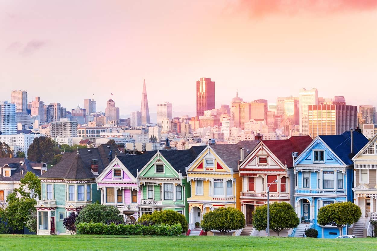 The colorful Painted Ladies houses in San Francisco, with the city in the backdrop