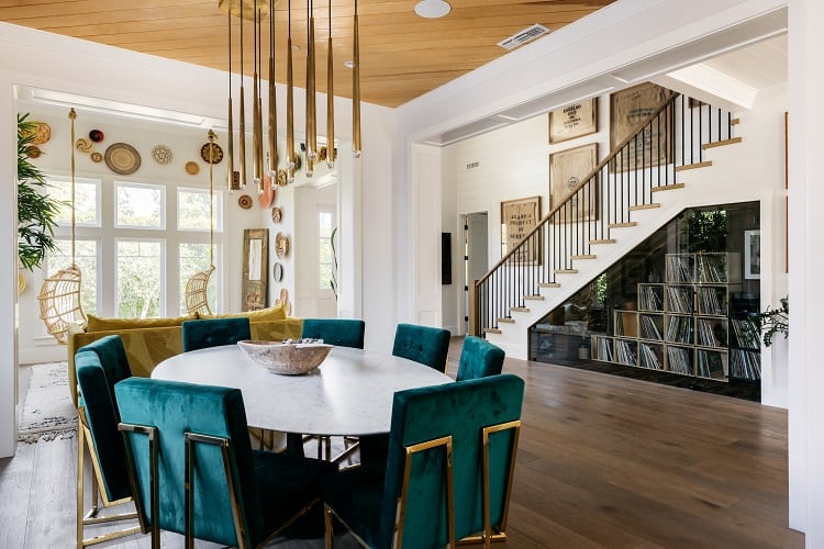 view from the living room to the staircase and the vinyl record collection underneath 