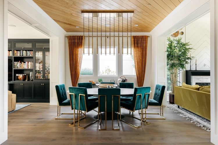 elegant dining room with turquoise chairs