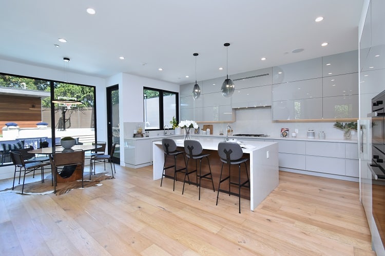 modern white kitchen with wood accents