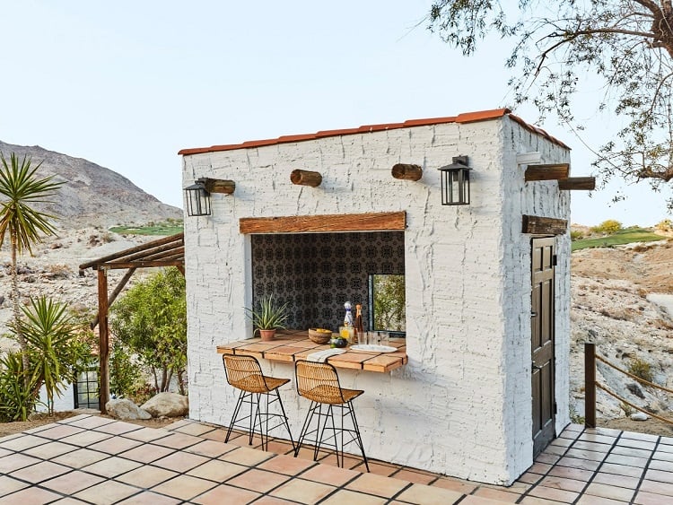 rustic outdoor bar converted from a storage shed.