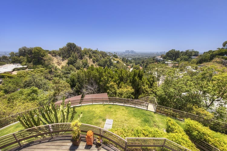 terraced balcony with views of greenery and the canyon 