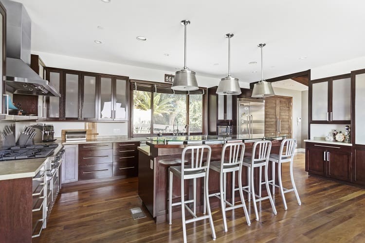 mahogany kitchen with an island and counter seating