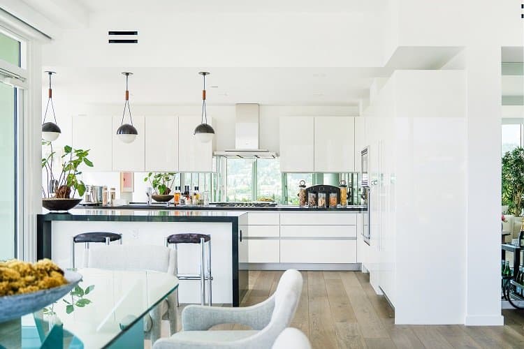 the sleek white kitchen of a private residence at the Four Seasons in Los Angeles