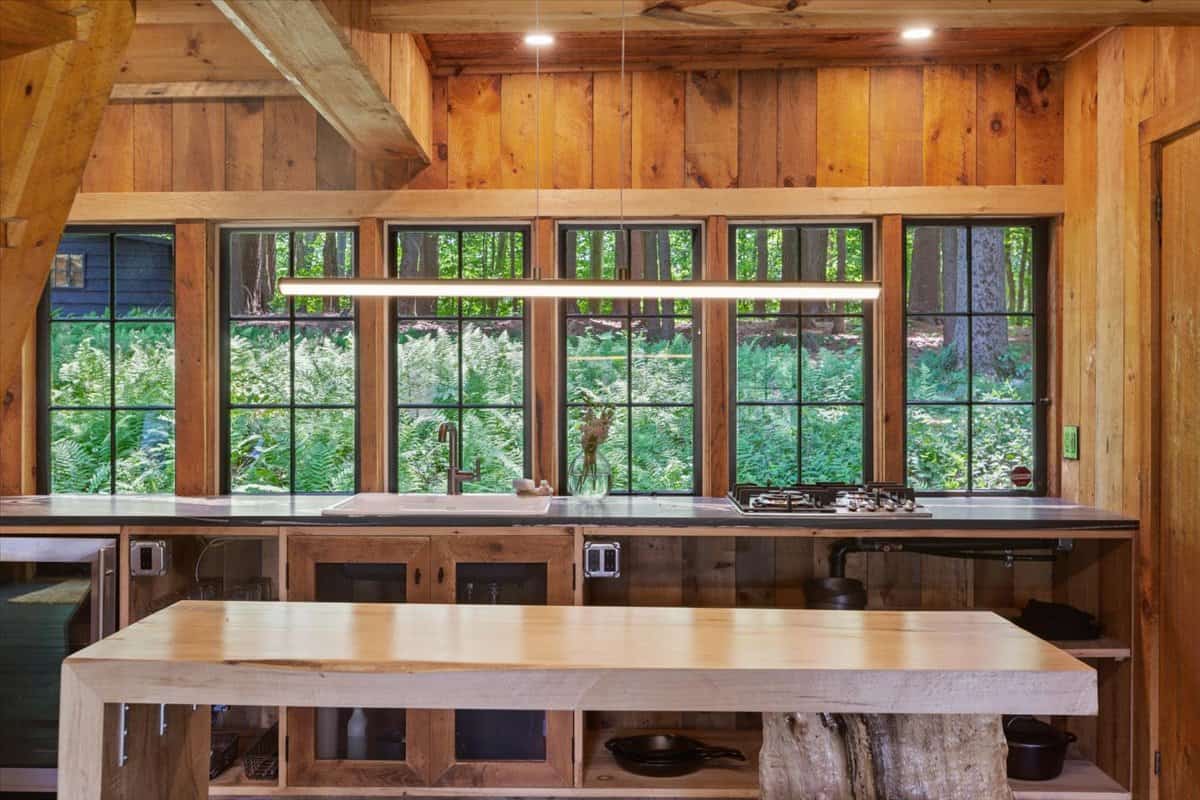 windows of the cottage looking out to the verdant outdoors