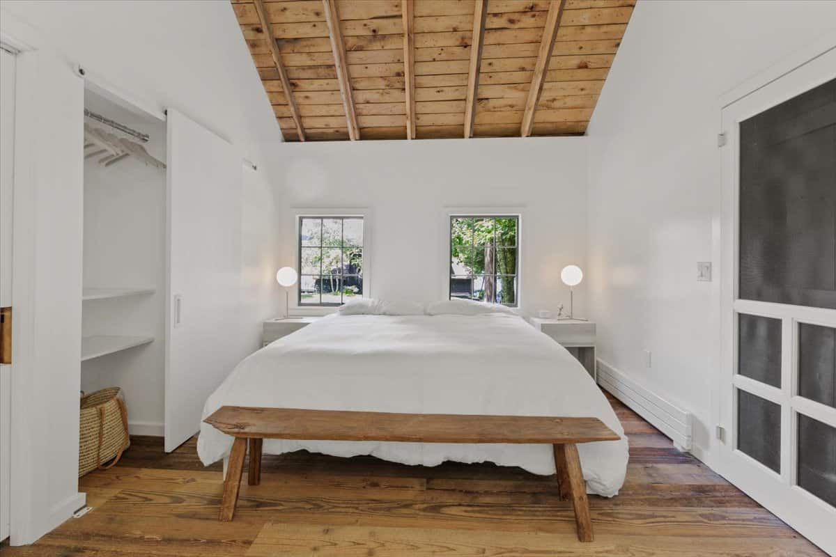 bedroom inside the wooden cottage at Atwater