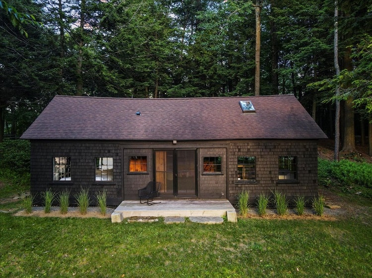 a wooden cottage guest house on the property