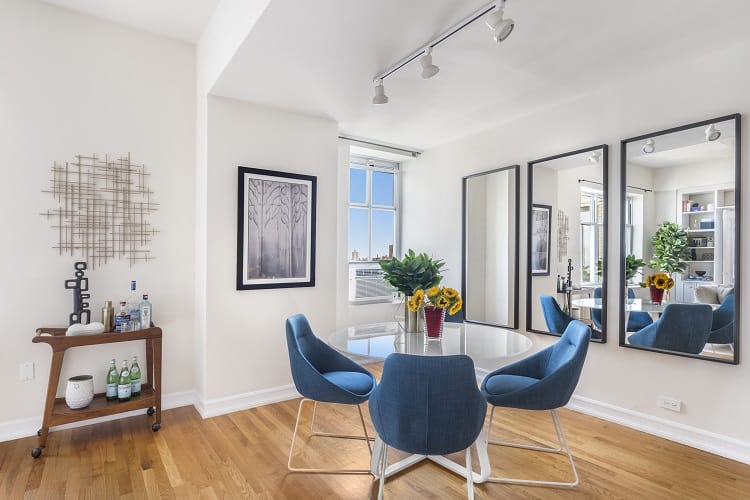 Dining area of a 2-bedroom condo in the Oliver Cronwell building in New York.