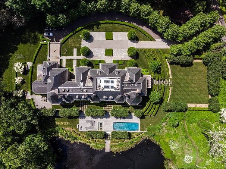 Aerial view of the chateau-like residence at 266 Michigan Road in New Canaan, CT and its landscaped grounds