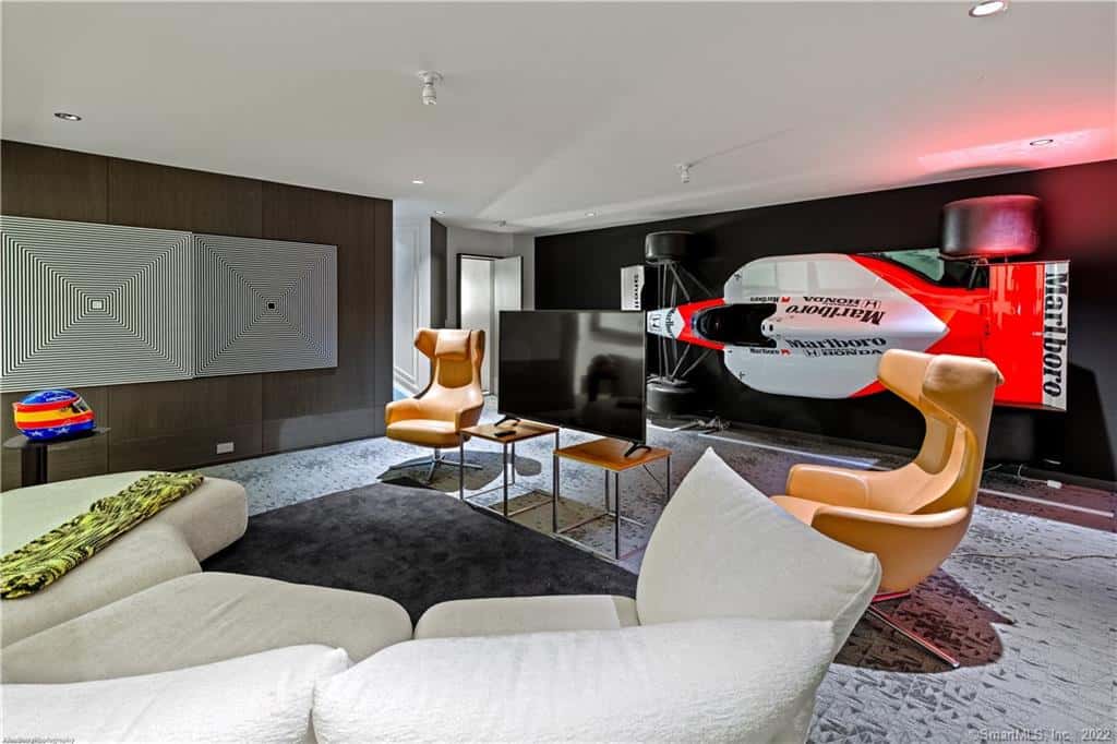 home theater with a racing car on the wall