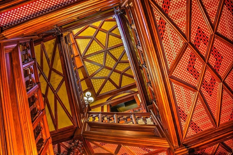 intricate ceiling details and staircase inside Mark Twain's house and museum in Hartford, CT.