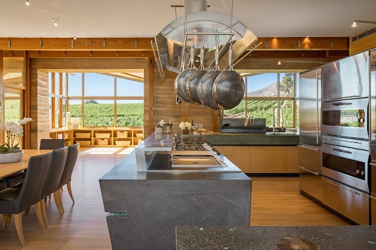 luxury kitchen with exposed pots inside the main residence at Meteor Vineyard Estate, Napa Valley. 