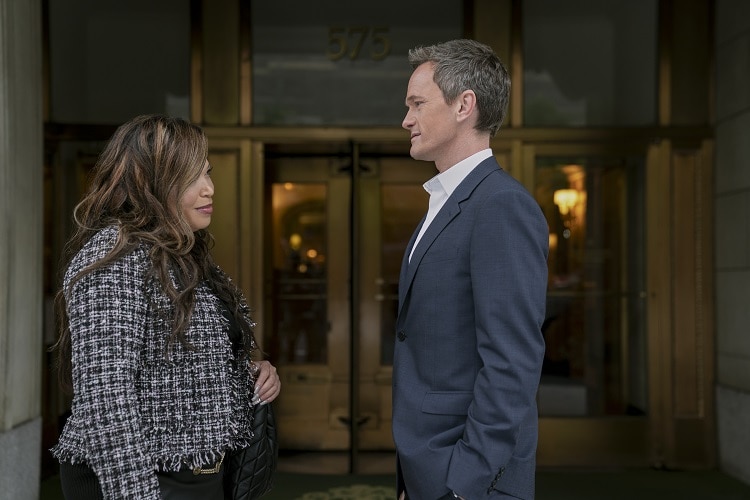 Tisha Campbell as Suzanne Prentiss, Neil Patrick Harris as Michael Lawson standing in front of a building in episode 101 of Uncoupled.