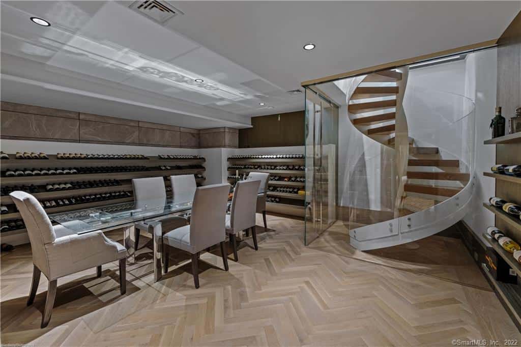 winding staircase leading to the lower level wine cellar