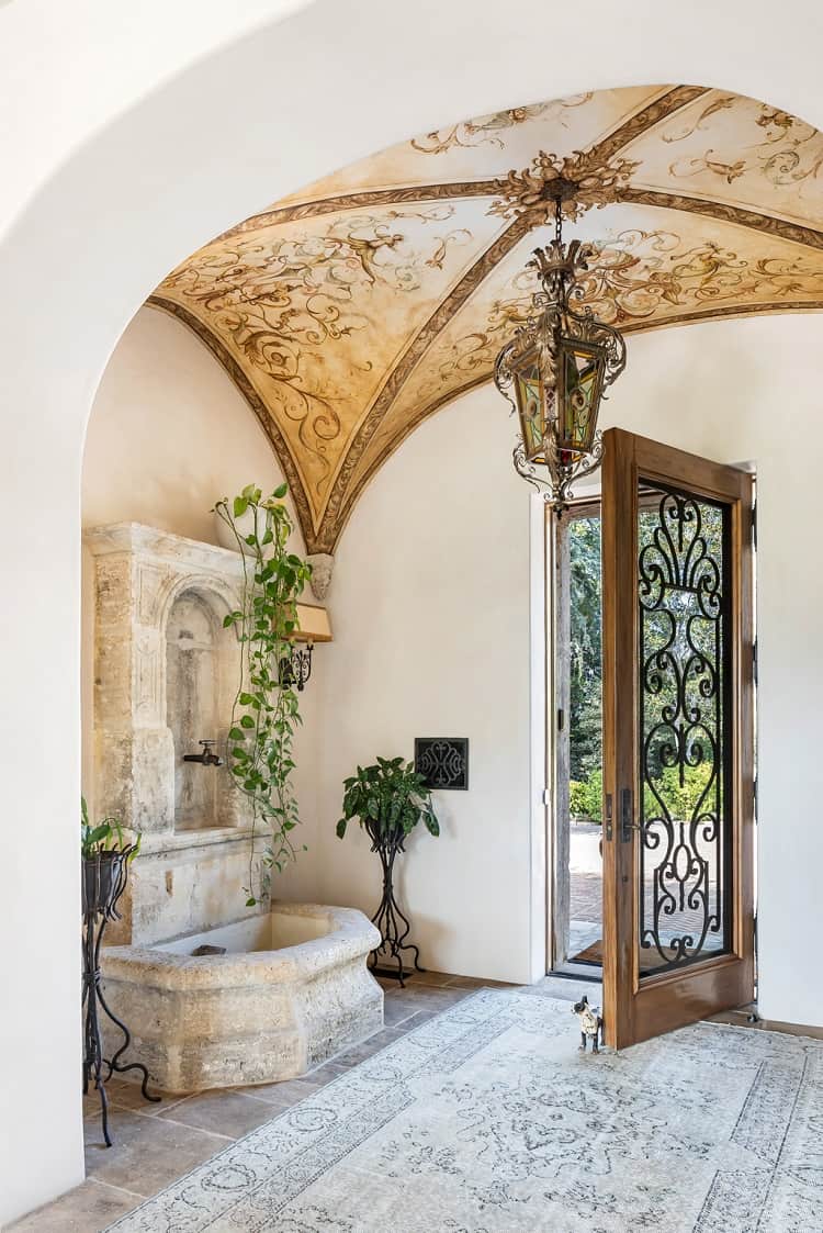 arched entryway with intricate vaulted ceiling