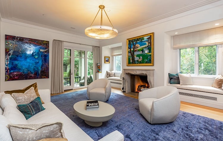 living room with fireplace and chandelier