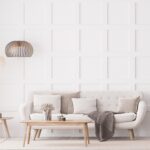 minimalist living room with sofa, white wood paneling