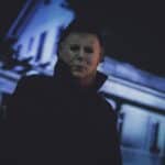 horror movie character Michael Myers with the Halloween house in the background