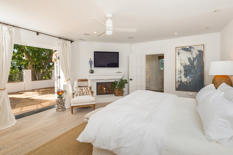 secondary bedroom with fireplace  inside Sandra Bullock's house