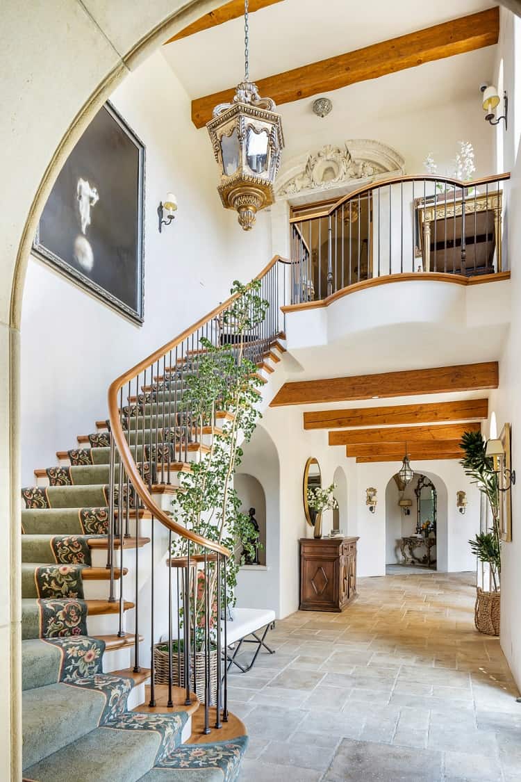 imposing staircase leading to inside balcony