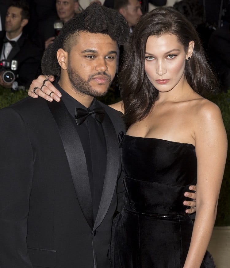 recording artist The Weeknd and model Bella Hadid, holding each other