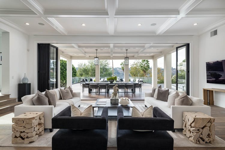 living room with glass doors that open to the terrace