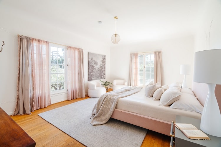 primary bedroom with large windows inside Marilyn Monroe's former home