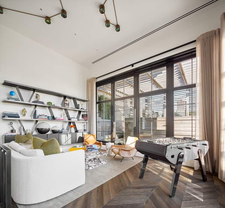 the living area with the famous bookshelves in Trevor Noah's apartment